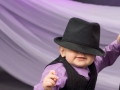 Baby with a hat over his eyes during a photo session